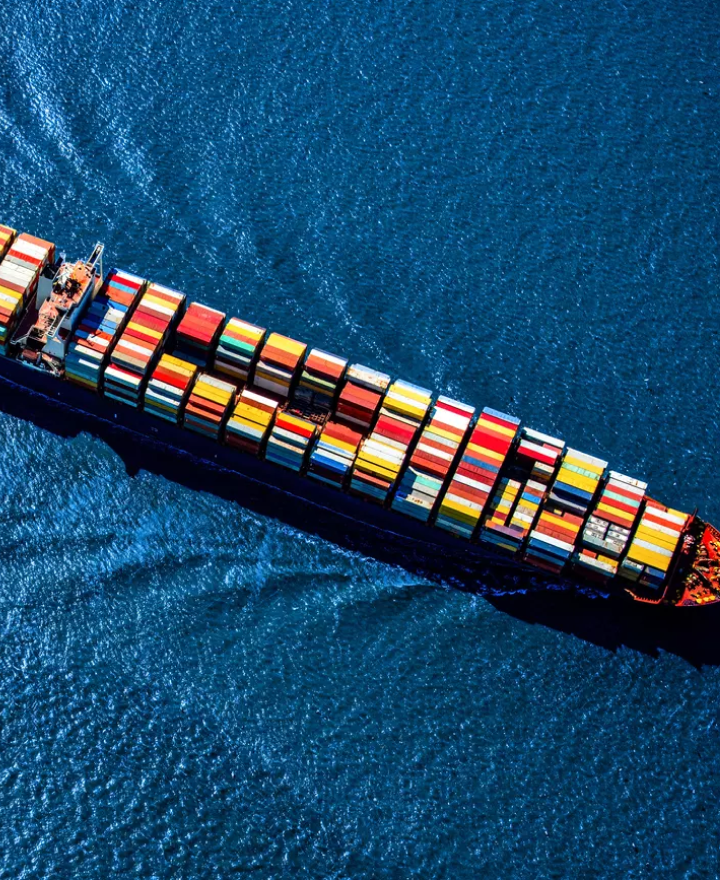 Global sea freight with a container ship at sunset